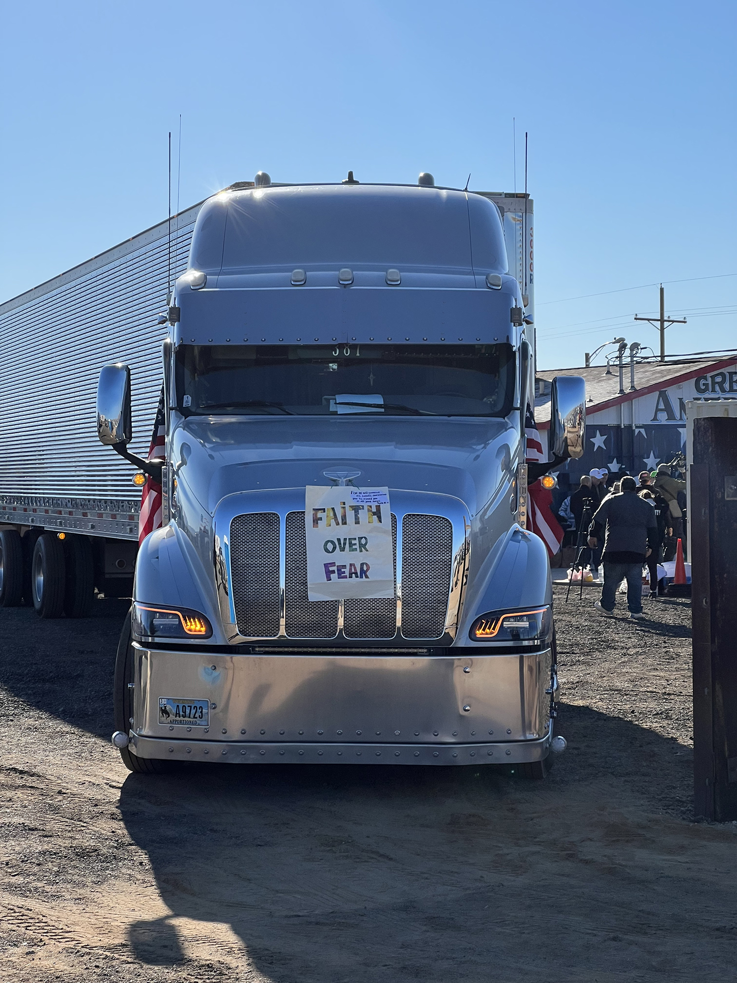 A truck with a sign on it that says faith over fear