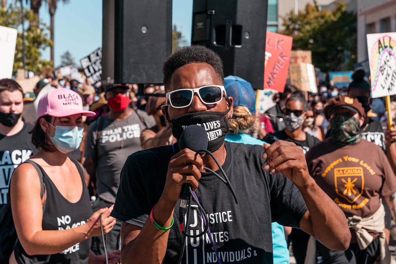 An organizer of the “Zero Tolerance for White Supremacy” protest leads the march from the Contra Costa County Courthouse to the Waterfront Park.