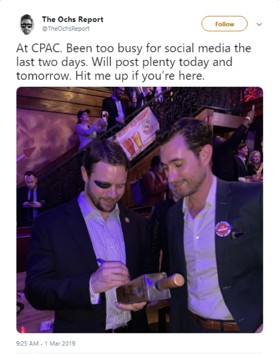 Nick Ochs posing at CPAC with Texas Representative Dan Crenshaw.