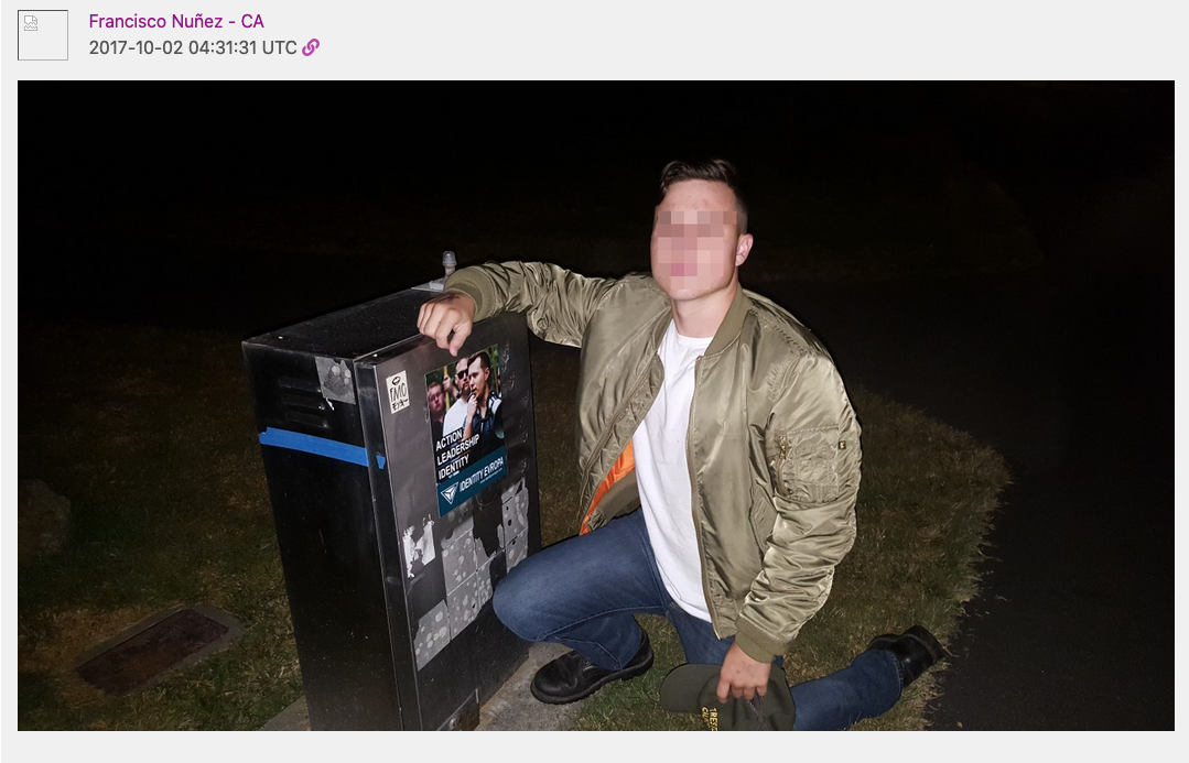 Sanchez poses with an Identity Europa sticker he put up